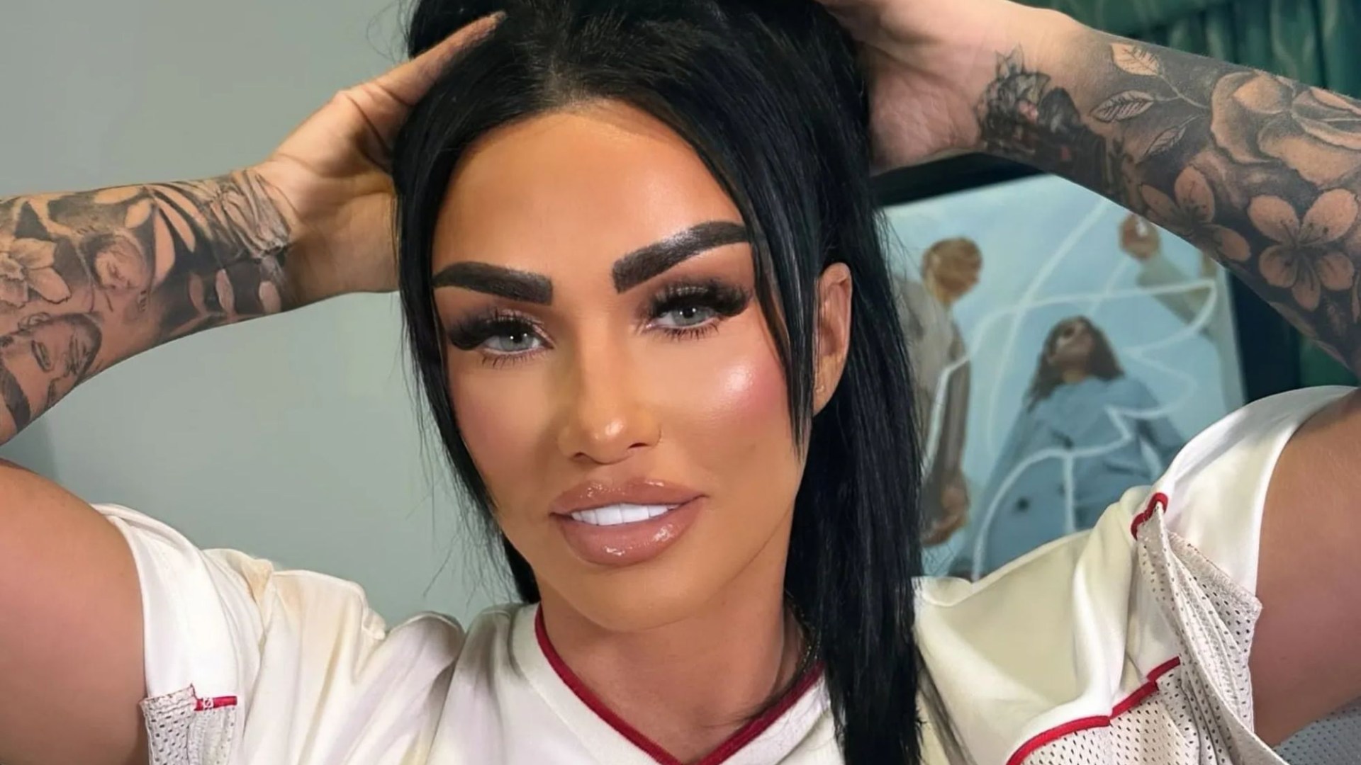 Katie Price shares clip of dog WRESTLING her £1200 Sphynx cat after charity begs her to be banned from owning pets